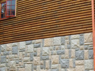 'Stone' cladding in conjunction with timber cladding