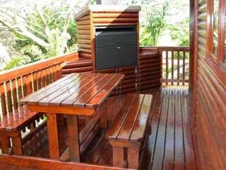A built-in braai with storage space on an extensive deck