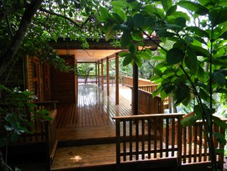 A Large, Extensive And Elevated Deck With Beautiful View Onto The Garden Below