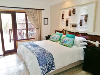 A Modern Bedroom. Note The Ceramic Floor Tiles And Painted Walls