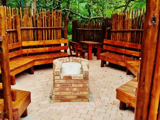 A Paved Fire Pit With Seating Of Up To 20 People