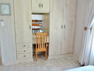 Built-in Cupboards With Dressing Table And Porceain Tiles