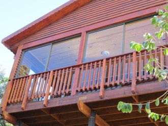A House Built On Stilts On A Slope