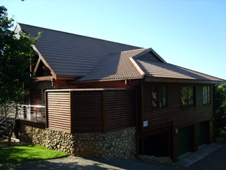 Note river stone retaining foundation wall.